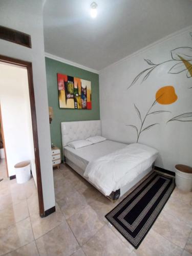 Postel nebo postele na pokoji v ubytování HK Homestay