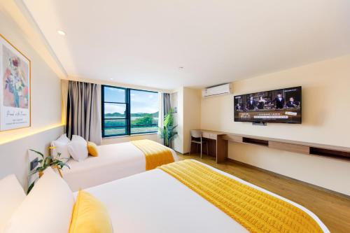 Katil atau katil-katil dalam bilik di Zhujiajian Chunyu Qiushe Apartment