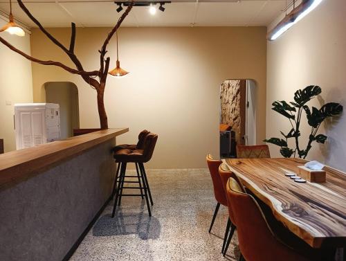 a bar in a room with a table and chairs at Senju Georgetown Heritage PrewarHouse 4BR 5-15 pax in George Town