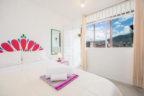 Una cama o camas en una habitación de Retablo Boutique Hotel