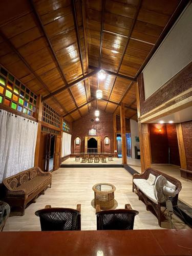 a large living room with couches and a table at The Redstone Oasis Villa in Welhe