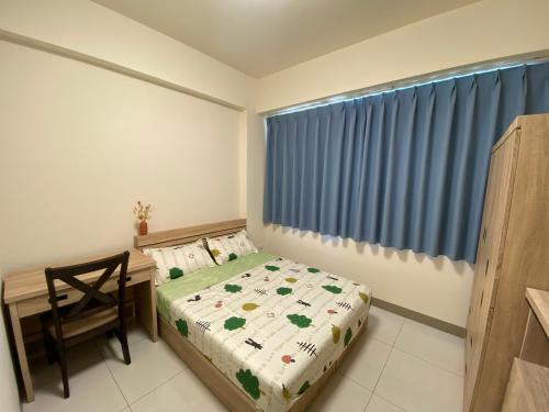 Ένα ή περισσότερα κρεβάτια σε δωμάτιο στο 欣欣背包商旅青旅酒店3館