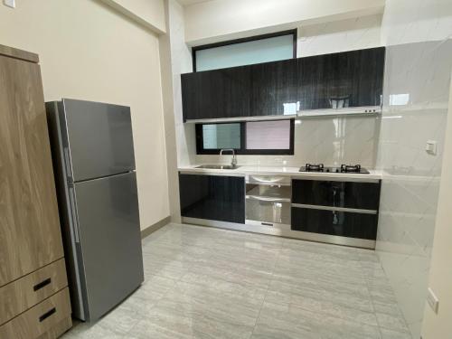 Η κουζίνα ή μικρή κουζίνα στο 欣欣背包商旅青旅酒店3館