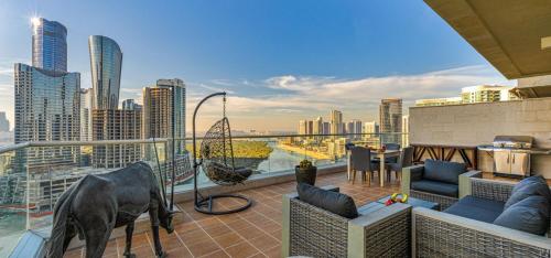 a balcony with a view of a city skyline at Reem Island Beach Haven with Stellar Balcony Views in Abu Dhabi
