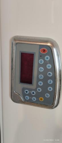a remote control attached to the side of a refrigerator at Villa Agapi 2 in Kamilari