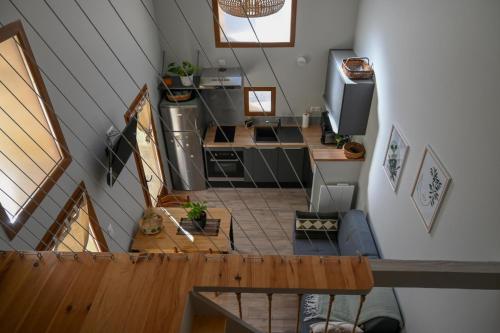 an overhead view of a kitchen in a tiny house at L'ecrin de lacoste in Chasteaux