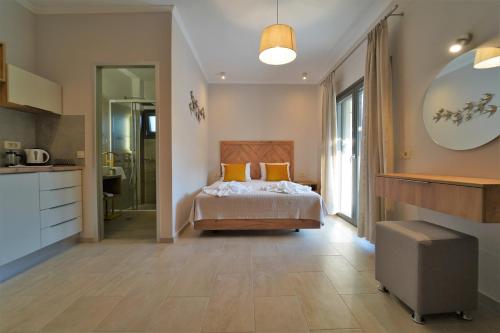 a bedroom with a bed and a large mirror at MERAVIGLIA in Parga