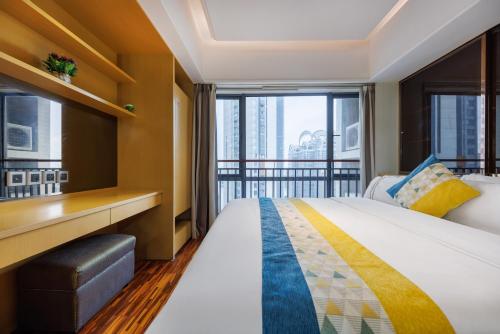 Postel nebo postele na pokoji v ubytování Argyle WAIFIDEN Baolidian Hotel -Free shuttle bus during Canton Fair