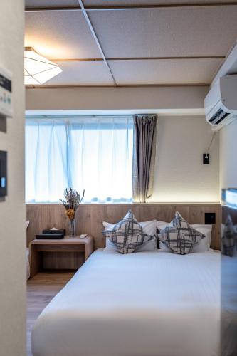 Apartment Hotel 11 Yasakaにあるベッド