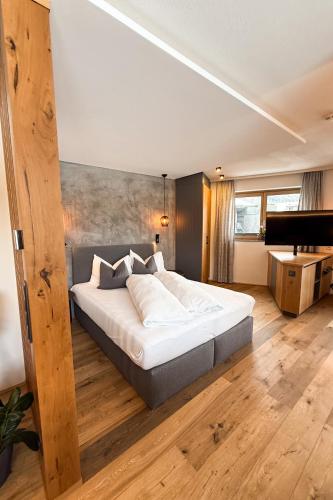 Katil atau katil-katil dalam bilik di Cabin8 Alpine Flair Apartments