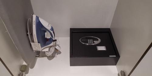 a blue and white hair dryer in a box at NU Hotel in Bintulu