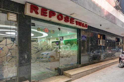 a store front of a repurchase window with a sign on it at Hotel Re Pose Villa Walking Distance From New Delhi Railway Station and R K Ashram Metro Station in New Delhi
