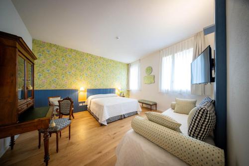 Postel nebo postele na pokoji v ubytování Albergo del Cuore