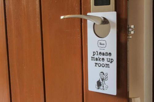 a sign on a door that says please make up town at The Henry Resort Siargao at Kermit in General Luna