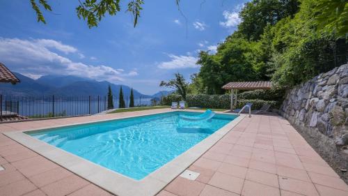 a swimming pool with a view of the water at Villa Aurelia in Plesio