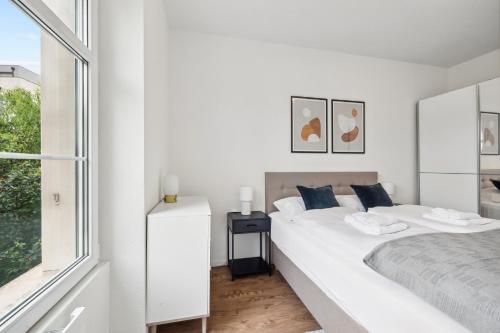 Voodi või voodid majutusasutuse The R Apartment Chrischona toas