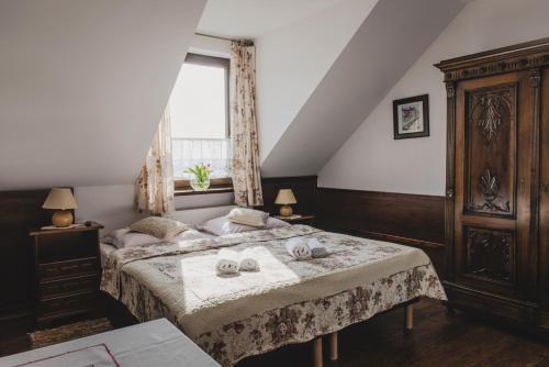 Tempat tidur dalam kamar di Agroturystyka Oświęcim