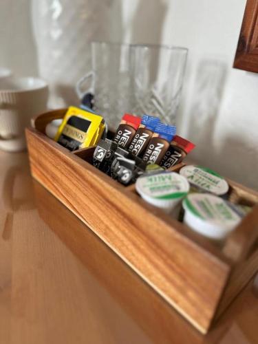 a wooden box filled with different types of items at The Olivers Guest House in Hereford