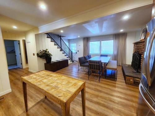 a living room with a table and a dining room at Troubadour's Landing in Kings Beach
