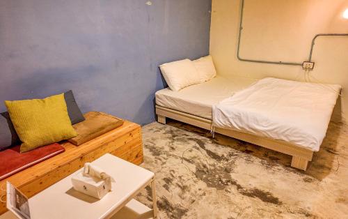 Postel nebo postele na pokoji v ubytování 62巷背包客棧 Lane62 Hostel