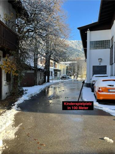 a car parked on a street with a sign on it at Schmiedhäusl in Kitzbühel