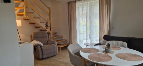 a small living room with a table and chairs at Domki Partecznik Wisla in Wisła