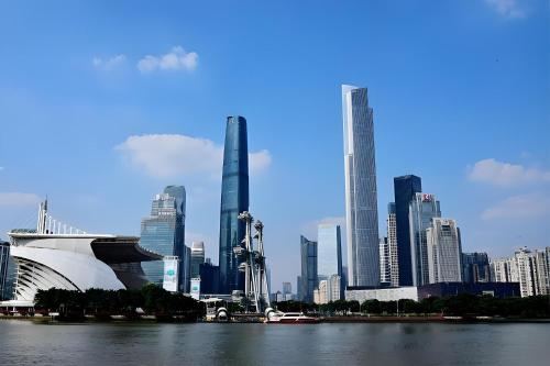 a view of a city with a river and buildings at Guangzhou Xi Yun - Lai Xizhou Hotel-Free shuttle bus during Canton Fair in Guangzhou