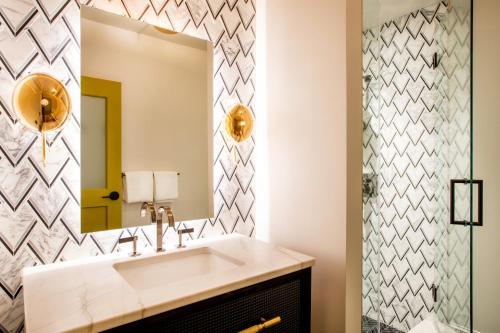 a bathroom with a sink and a mirror at The Bell Athens by Kasa in Athens