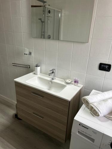 a bathroom with a sink and a mirror at Todeschini 27 in Brembate
