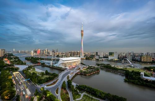 a view of a city with a river and a bridge at Guangzhou Xi Yun - Lai Xizhou Hotel-Free shuttle bus during Canton Fair in Guangzhou