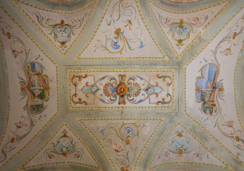 a ceiling with painted ceilings in a room at Anantara Convento di Amalfi Grand Hotel in Amalfi