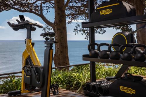 a gym with a view of the ocean at Anantara Convento di Amalfi Grand Hotel in Amalfi