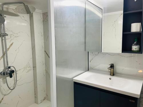 a bathroom with a sink and a shower at Bassatine Skoura in Skoura