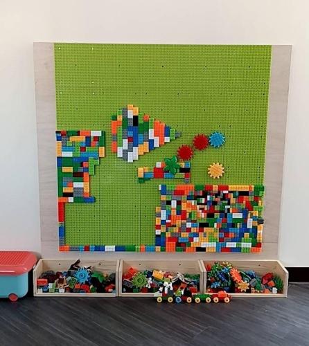 a lego wall with a bunch of legos at 藍月金門民宿 in An-ch'ien