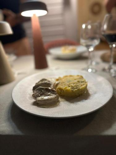 a white plate with three donuts on a table at 17 Les Palmes - Maison de charme - Piscine privée et accès plage in Sainte-Anne