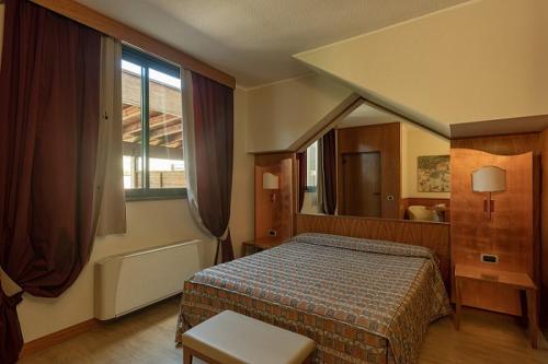 Postel nebo postele na pokoji v ubytování Hotel Motel Futura