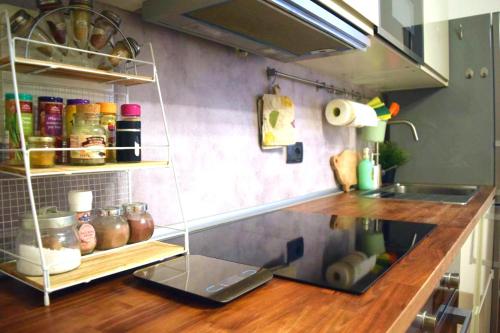 a kitchen with a counter with a counter top with a counter at Anna's Home - Appartamento nel cuore di Genova in Genoa