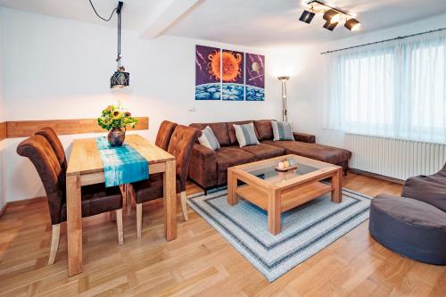 a living room with a couch and a table at Ferienhaus Sternschnuppe in Oberwesel