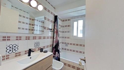 a bathroom with a sink and a mirror at For Sea Lovers in Cubelles
