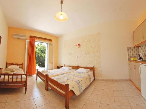Ένα ή περισσότερα κρεβάτια σε δωμάτιο στο Emilia Apartments