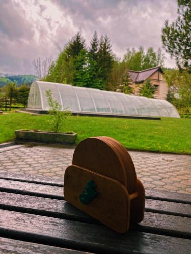 a wooden box sitting on top of a bench at Penzion POD SMRKEM - budova A in Jeseník