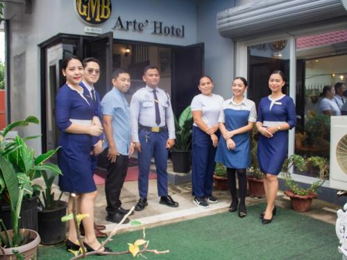 a group of people standing in front of a hotel at Gmb-Arte' Hotel in Sogod
