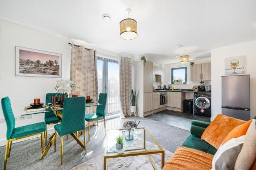 a living room with a couch and a table at Affordable 1 & 2 Bed Apartments in Slough, Great Heathrow Location in Colnbrook