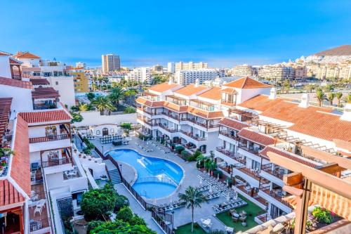 an aerial view of a resort with a pool and buildings at Coral Los Alisios in Los Cristianos