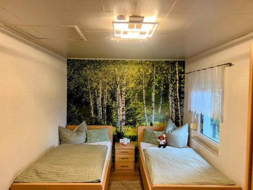 Ένα ή περισσότερα κρεβάτια σε δωμάτιο στο Ferienhaus Fuxbau