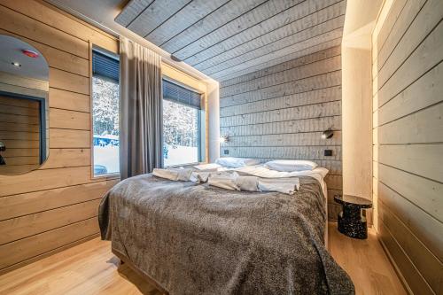 Ένα ή περισσότερα κρεβάτια σε δωμάτιο στο Kaira Chalet by Aavalevi Holidays