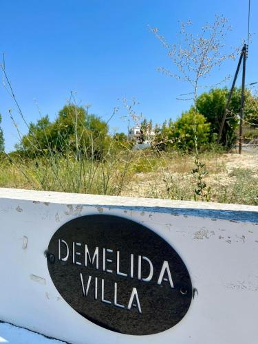 a sign that reads demelida villa on a wall at Demelida Villa in Tsada, Paphos in Tsadha