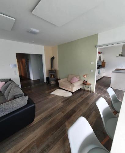 a living room with a couch and a table at Ferienhaus Mölltal in Penk