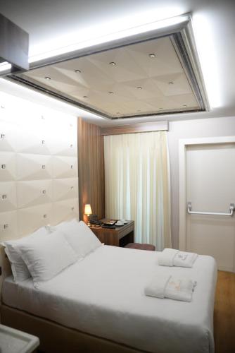 Ένα ή περισσότερα κρεβάτια σε δωμάτιο στο Perante Hotel Şişli