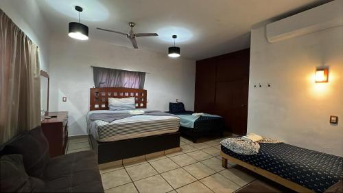 Postel nebo postele na pokoji v ubytování Hotel Colonos Los Cabos